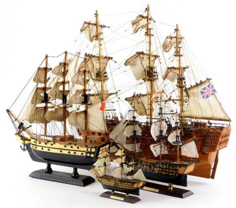 A scale model of a three masted ship, another smaller ship, and two models of HMS Victory. (4)