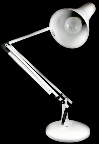 A white painted Anglepoise type adjustable desk lamp.