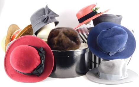 A quantity of hats, to include straw hats, fur hat with label for Whiteley, etc.