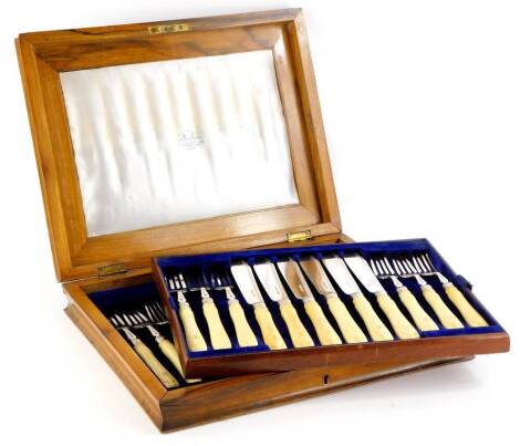 A Victorian canteen of silver and ivory handled fish knives and forks, Sheffield 1873, in a fitted walnut and burr walnut case, with brass cartouche, stamped to interior Jenner and Newstub, 9cm high, 30cm wide, 28cm deep.