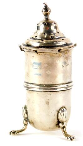 A silver pepper pot, raised on lion paw feet, Birmingham assay, hallmarks rubbed, 9cm high, 1oz.