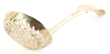 A William IV silver sifter spoon, with pierced bowl and S monogram to handle, London 1833, 16cm wide, 2¼oz.