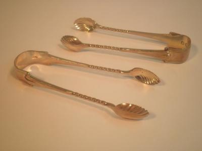 Two pairs of Victorian silver sugar tongs