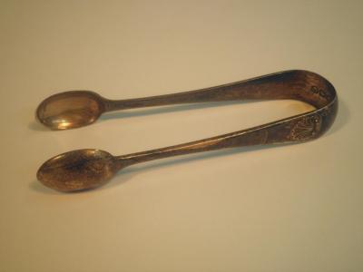 A pair of late Victorian silver sugar tongs