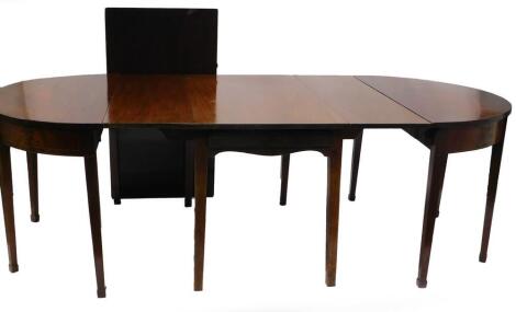 A mahogany D end dining table, with boxwood and ebony stringing, comprising two D ends each with square tapering legs, an associated central section, on plain legs with two drop leaves, 72cm high, the top 226cm.