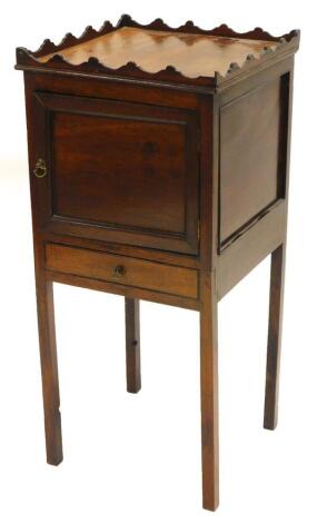 A 19thC mahogany pot cupboard, with a raised gallery above a panelled door and a drawer, on tapering legs, 83cm high, 37cm wide.