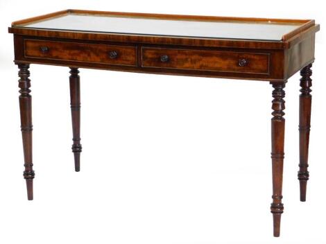 An early 19thC mahogany washstand, the raised gallery above two frieze drawers, each with turned wooden handles, on turned tapering legs, 78cm high, 121cm wide, 51cm deep.