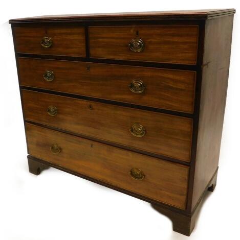 An early 19thC mahogany chest of drawers, the top with a moulded edge above two short and three long drawers, with oval brass handles on bracket feet, 105cm high, 113cm wide.