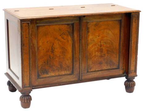 A 19thC mahogany chest, the top with a moulded edge, enclosing a vacant interior above two false doors and two plain pillars, with lobed bun feet, adapted from a cupboard, 72cm high x 103cm wide.