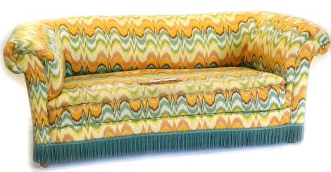 An Edwardian Chesterfield sofa, upholstered in a multi-coloured zig-zag design fabric, on bun feet, (fabric AF), 183cm wide.