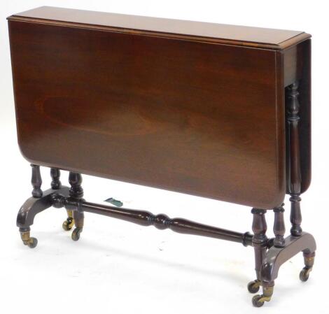 A Victorian mahogany Sutherland table, with a rectangular top with rounded corners and a moulded edge, on turned end supports with brass castors, 89cm wide.