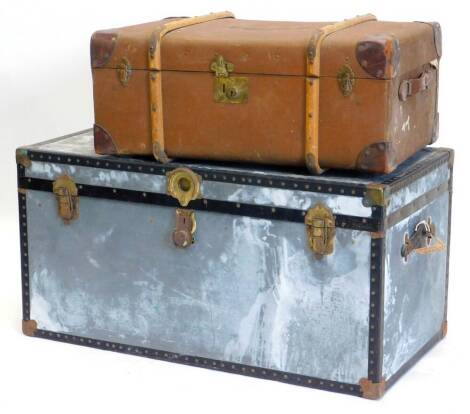 A wood and canvas trunk, with leather corners and a metal trunk (2).