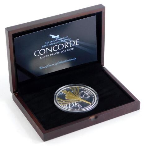 A 50th Anniversary of Concorde silver proof 5oz coin, with certificate of authenticity and fitted case.