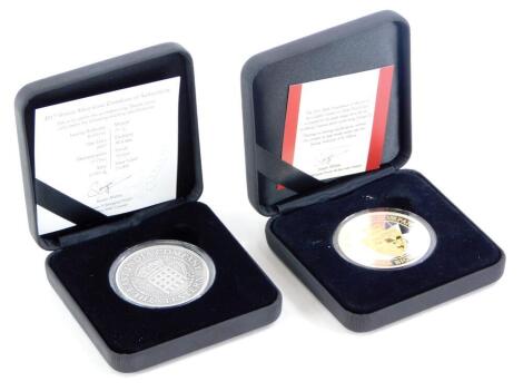 Two commemorative silver coins, a 2017 silver coin with certificate, issued by the St Helena Mint 26.7g, twenty five pence denomination, O.999 of silver from the East India Company, and another for the 2016 200th Anniversary Golden Guinea 1oz silver proof