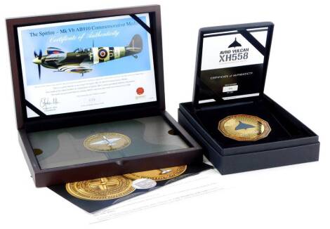 A bronzed metal marine spitfire coin, with certificate of authenticity, number 36 of 250, in fitted case and an Avro Vulcan commemorative medal, limited edition number 326 of 558, with certificates and fitted box.