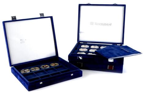 A collection of Royal Family Queen Elizabeth II related commemorative medallions, issued by the West Minister Mint, with 24ct gold on copper, in three cases.