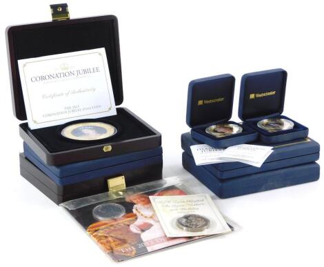 A quantity of gold plated copper commemorative coins or medallions, each relating to events involving the Royal Family, various dates etc.