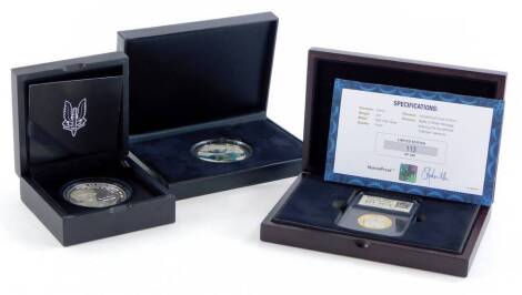 Four medallions or coins relating to the Military, a silver 2oz coin to commemorate the SAS Regiment, a UK two pound coin to commemorate the Magna Carta, and a 75th Anniversary of the Battle of Britain silver Numisproof 2oz coin. (4)