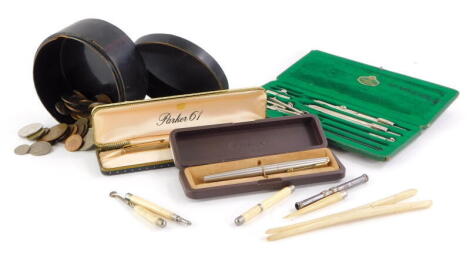 A quantity of pens, etc., to include a Faber Kastel drawing instrument set, Parker 61 pen, bone handled items, etc., and various foreign coins, etc.