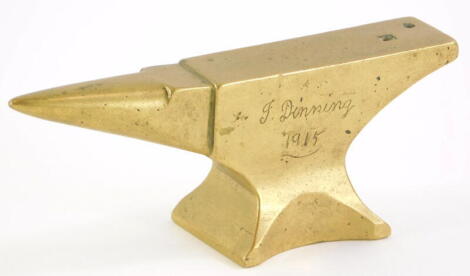 A trench art brass model of a miniature anvil, 11.5cm long.