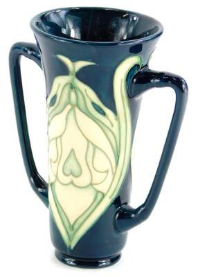 A Moorcroft pottery two handled vase, decorated with Art Nouveau motifs, made for the Moorcroft Collectors Society, number 5 of 56 to underside, and various impressed marks, 15cm high.