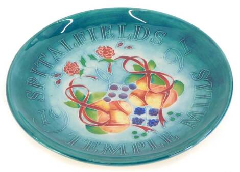 A Moorcroft pottery Spitalfields Temple Mills commemorative plate for 1991, 22cm diameter.