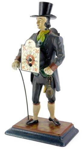 A Dutch painted spelter figural mantel clock, modelled in the form of a gentleman wearing a top hat, and with a cane the arched dial decorated with windmills etc., on a rectangular base, 42cm high.