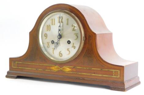 An Edwardian mahogany boxwood strung mantel clock, the silver dial with gilt Arabic numerals, on bracket feet, 42cm wide.