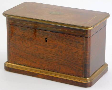 A 19thC French rosewood and brass inlaid tea caddy, the hinged lid engraved with initials enclosing two lidded maple veneered covers and a maple interior to the box, on a velvet covered plinth, 13cm high, 20cm high.