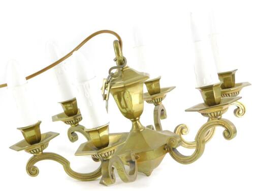 A brass six branch chandelier, with simulated candles in the Dutch style, 47cm wide.