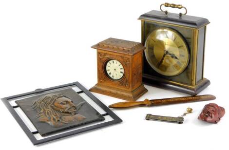 A bronzed metal plaque, labelled for Studio Laurana, Pesaro, Italy, depicting Christ, 18cm x 14cm, a carved pocket watch case with white metal pocket watch, inlaid page turner, mantel clock, a commemorative penknife, etc. (AF)