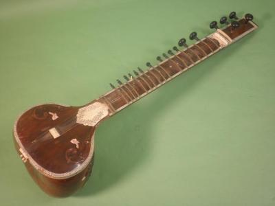 A 20thC Indian Sitar, applied and inlaid with bone, with ebonised