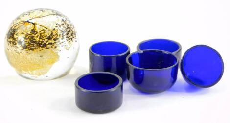 An art glass paperweight, signed Sam Herman Studio 1981, and a collection of five Bristol Blue glass liners.