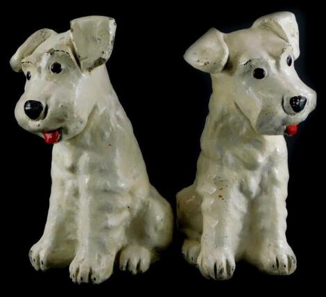 A pair of competition cream painted terrier garden ornaments, 29cm high.