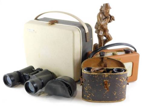 A Grundig projector, a Roberts radio, a pair of Tasco 20x50 binoculars, lacking case, Pentax 8x21 binoculars, Watson & Baker Co Ltd 6x binoculars and a carved wooden figure. (6)