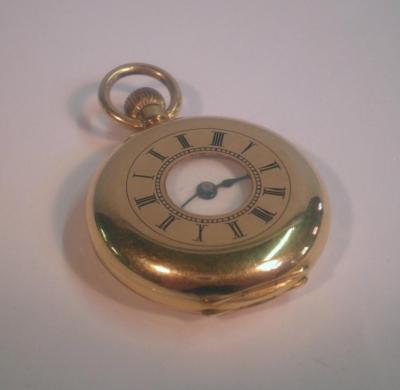 An 18ct gold cased small size half hunter fob watch