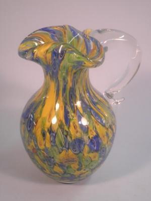 A Murano glass jug, with millefiori type decoration in red, blue,