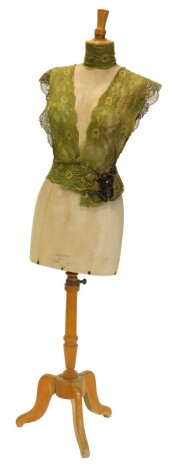 A dressmaker's dummy, on a turned wooden stand with tripod stamped Stockman Paris, 159cm high.
