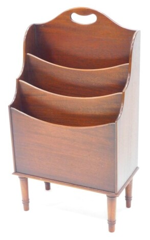 A mahogany three division magazine rack, with a pierced handle on turned legs, 39cm wide.