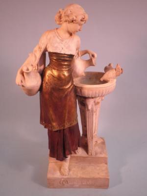 A late 19thC Continental parcel gilt composition statue in the form of