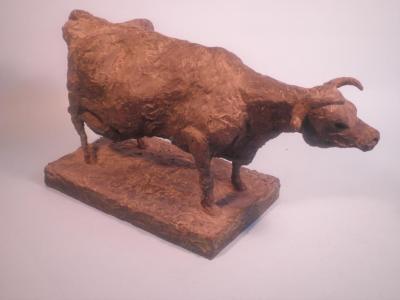 A modern plaster and fibreglass sculpture in the form of a cow