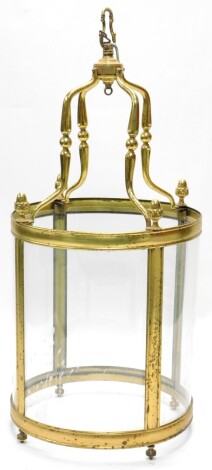 A large brass lantern, with four curved glass panels, 120cm high, 54cm diameter.