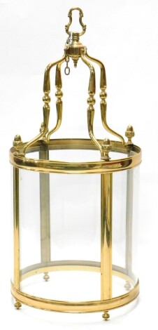 A large brass lantern, with four curved glass panels, 120cm high, 54cm diameter.