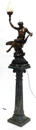 After Emile Louis Picault (1833-1915). A spelter figure of a gentleman carrying a torch, seated on an eagle, inscribed Letud Affranchit La Pensee, on a marble plinth, 104cm high overall, and an associated modern simulated bronze pedestal 101cm high. Buye
