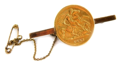 A Queen Victoria half gold sovereign bar brooch, dated 1897 and applied to 9ct gold brooch back, 4cm wide, with safety chain, 5.5g all in.