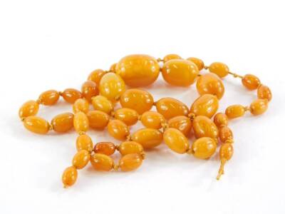 A butterscotch amber necklace, with various graduated beads, approximately 80cm long overall.