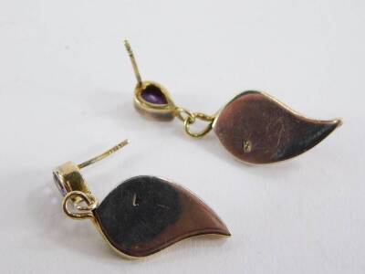 A pair of Art Nouveau style amethyst and silver drop earrings, the tear drop cut amethyst studs with a bi-colour lily drop, stamped to rear 925, 4cm high, lacking backs, 7.4g all in. - 2