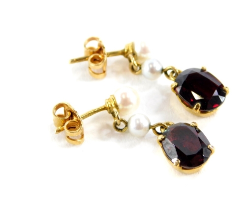 A pair of costume jewellery drop earrings, each set with red imitation garnet stone and various cultured pearls, on gold plated backs with maker's stamp BF.