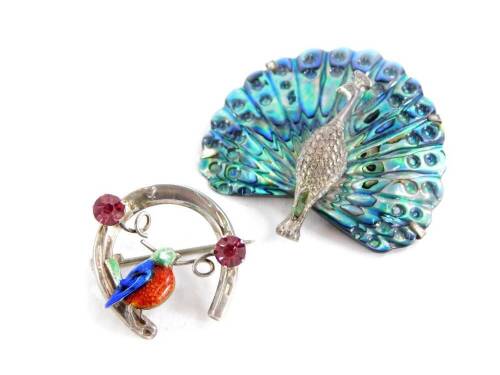 Two animal brooches, comprising a mother of pearl and white metal peacock brooch, stamped sil 925, 4.5cm wide, together with a silver and enamel bird brooch set with two pink paste stones, in a horseshoe shape stamped sterling silver, maker's stamp W.BS,