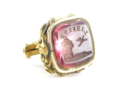 A February Liberty gilt metal seal, the engraving with Liberty symbol, with February coloured stone, 1.5cm high.